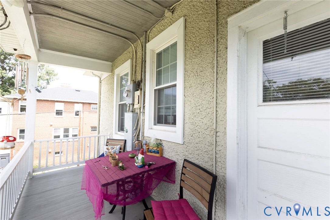 2726 Hanes Avenue, Brookland Park, Richmond, VA 23222 Covered porch with painted wood railing, stucco exterior, and white-framed windows