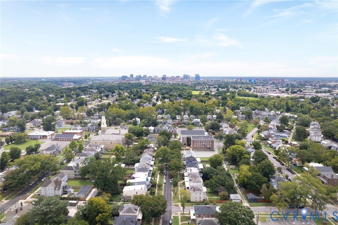 2726 Hanes Avenue, Brookland Park, Richmond, VA 23222 Aerial perspective showcasing a residential neighborhood with mature tree canopies and a distant cityscape