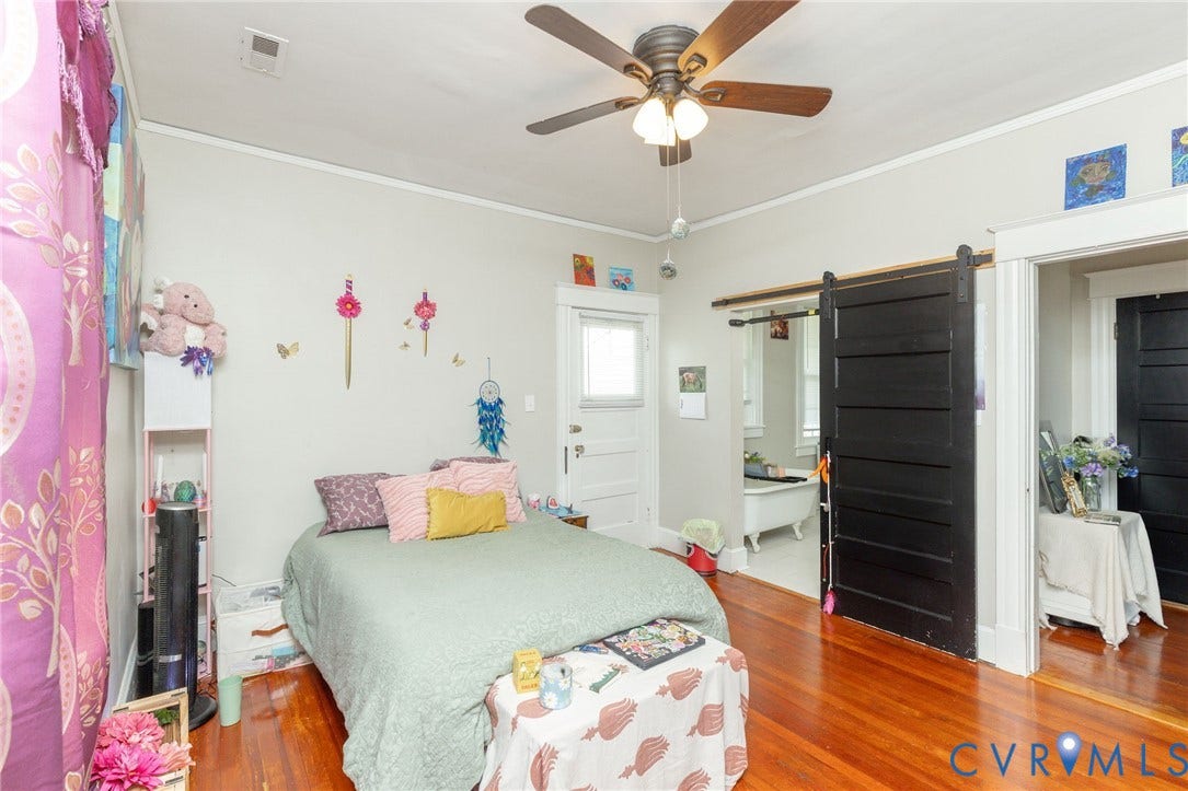 2726 Hanes Avenue, Brookland Park, Richmond, VA 23222 Hardwood flooring, ceiling fan with integrated lighting, white trim accents, and a barn door entry