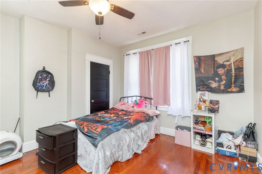 2726 Hanes Avenue, Brookland Park, Richmond, VA 23222 Hardwood-finish flooring, a ceiling fan with integrated lighting, a dark paneled door, and white trim