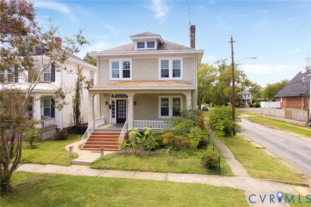 2726 Hanes Avenue, Brookland Park, Richmond, VA 23222 Stucco exterior with a covered porch featuring white railings, brick steps, and a dark entry door