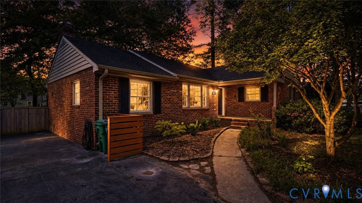 Brick exterior with black shutters