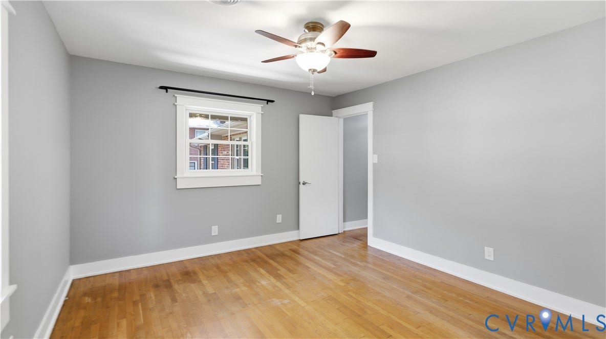 Hardwood flooring, painted walls, ceiling fan with light fixture, and white trim