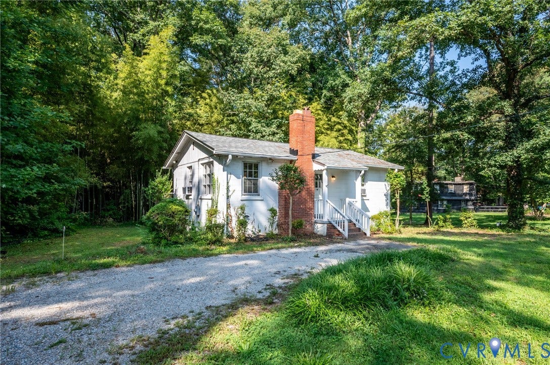 7107 Old Westham Road, Stratford Hills, Richmond, VA 23225 Single-story residence featuring a white facade and a prominent brick chimney