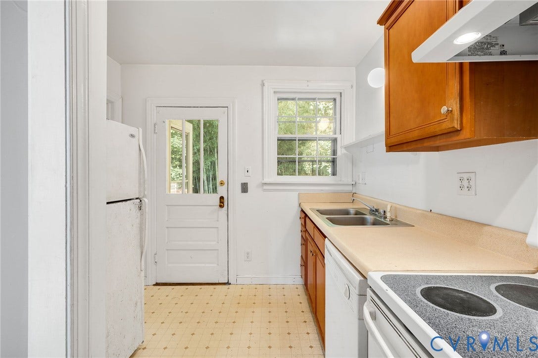 7107 Old Westham Road, Stratford Hills, Richmond, VA 23225 Kitchen featuring warm wood-finish cabinetry, a dual basin sink, and a white electric range with an overhead hood