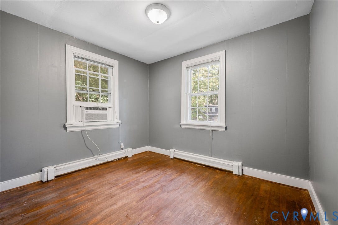 7107 Old Westham Road, Stratford Hills, Richmond, VA 23225 Hardwood flooring, painted walls, two windows, baseboard heating, ceiling-mounted light fixture
