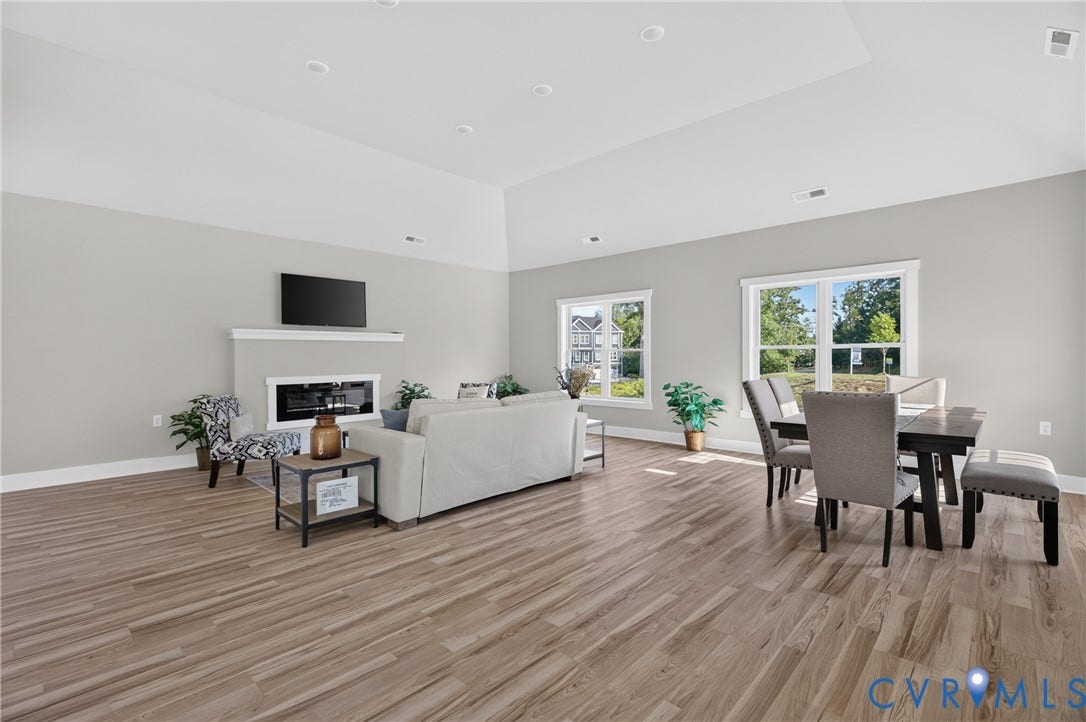6541 Hardee Haven Place, Midlothian, VA 23112 Vaulted ceiling, recessed lighting, wood-finish flooring, white trim, and a fireplace with a white mantel