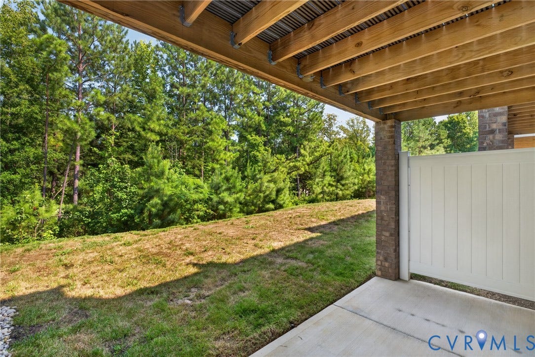 6541 Hardee Haven Place, Midlothian, VA 23112 Covered outdoor patio with a concrete surface, wooden joist ceiling, and a privacy fence