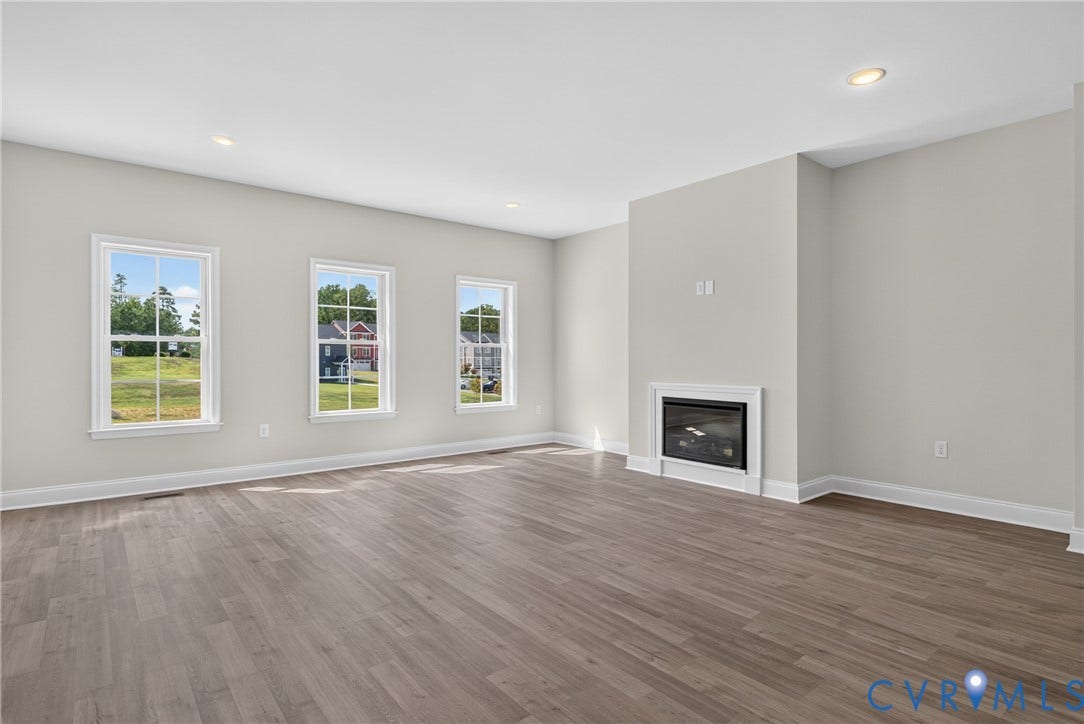 6541 Hardee Haven Place, Midlothian, VA 23112 Wood-finish flooring, recessed lighting, and a built-in fireplace with a white mantel