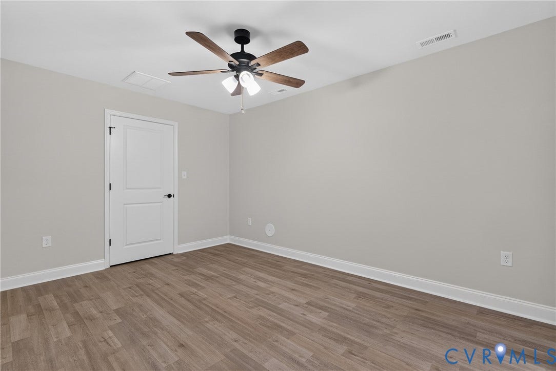 6541 Hardee Haven Place, Midlothian, VA 23112 Wood-finish flooring, light gray wall paint, and a ceiling fan with integrated lighting