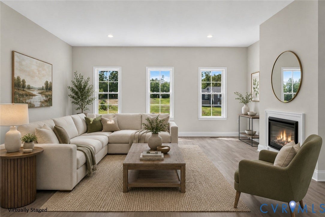 6541 Hardee Haven Place, Midlothian, VA 23112 Spacious room featuring multiple windows, wood-finish flooring, recessed lighting, and a built-in fireplace with a classic mantel