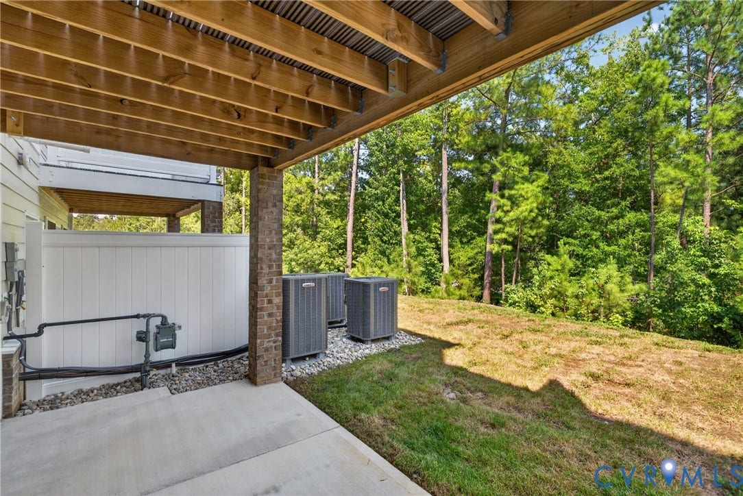 6541 Hardee Haven Place, Midlothian, VA 23112 Concrete patio with wood-finish ceiling, brick support columns, and green space