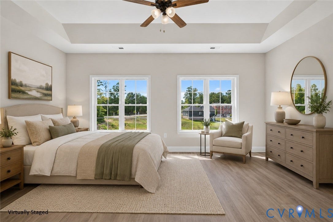 6541 Hardee Haven Place, Midlothian, VA 23112 Tray ceiling with a ceiling fan, two large windows, and wood-finish flooring