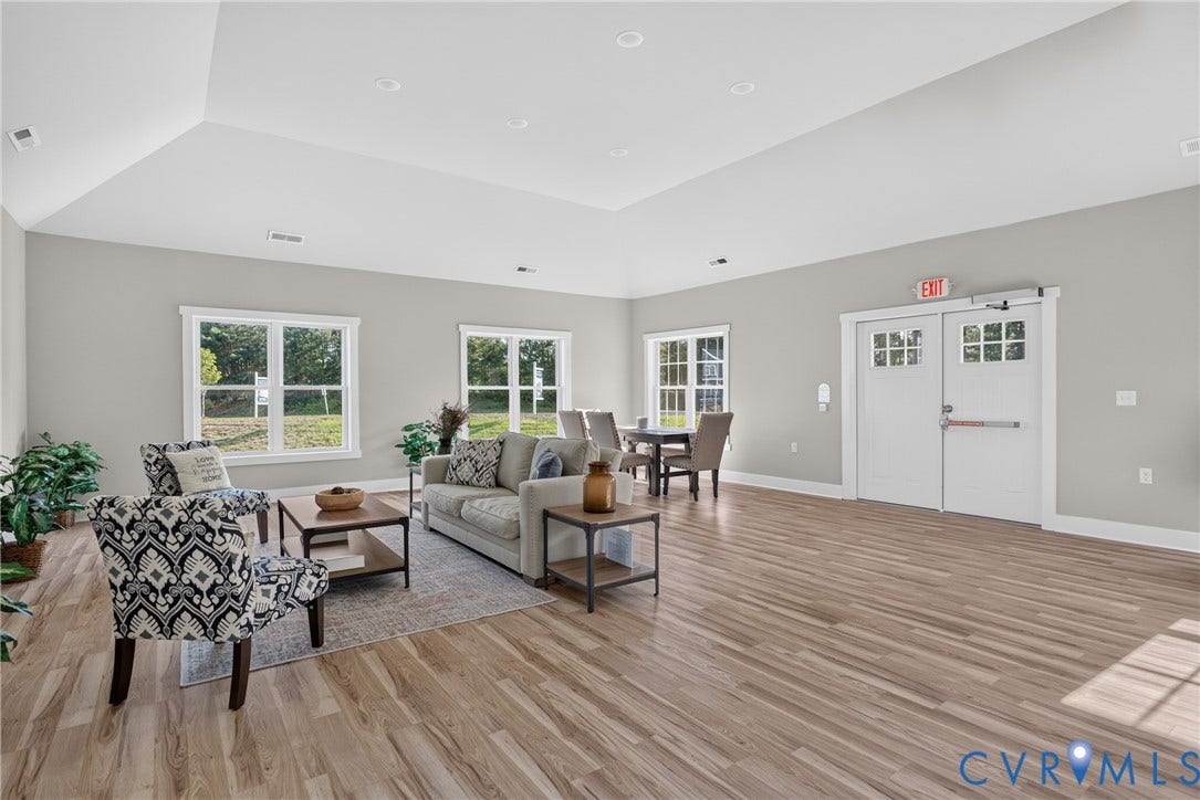 6545 Hardee Haven Place, Midlothian, VA 23112 Expansive common area featuring wood-finish flooring, recessed lighting, and a vaulted ceiling