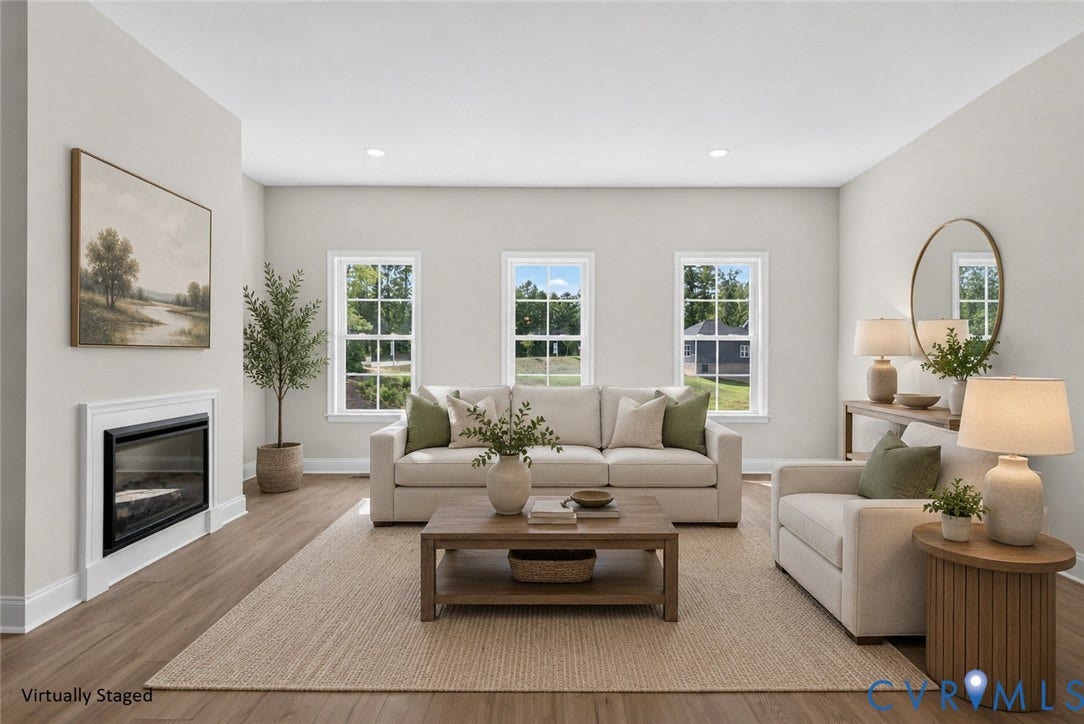 6545 Hardee Haven Place, Midlothian, VA 23112 Recessed lighting, wood-finish flooring, three windows with white frames, and a built-in fireplace with white mantel