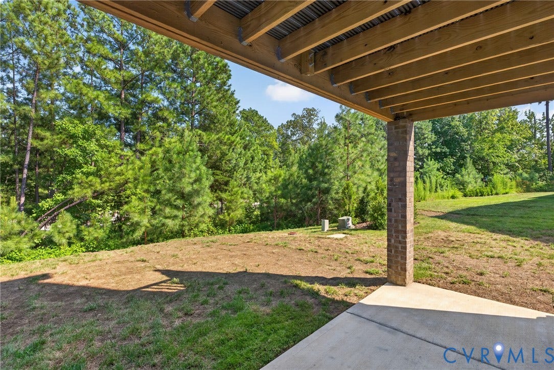 6549 Hardee Haven Place, Midlothian, VA 23112 Covered outdoor patio with a concrete slab and a brick support column