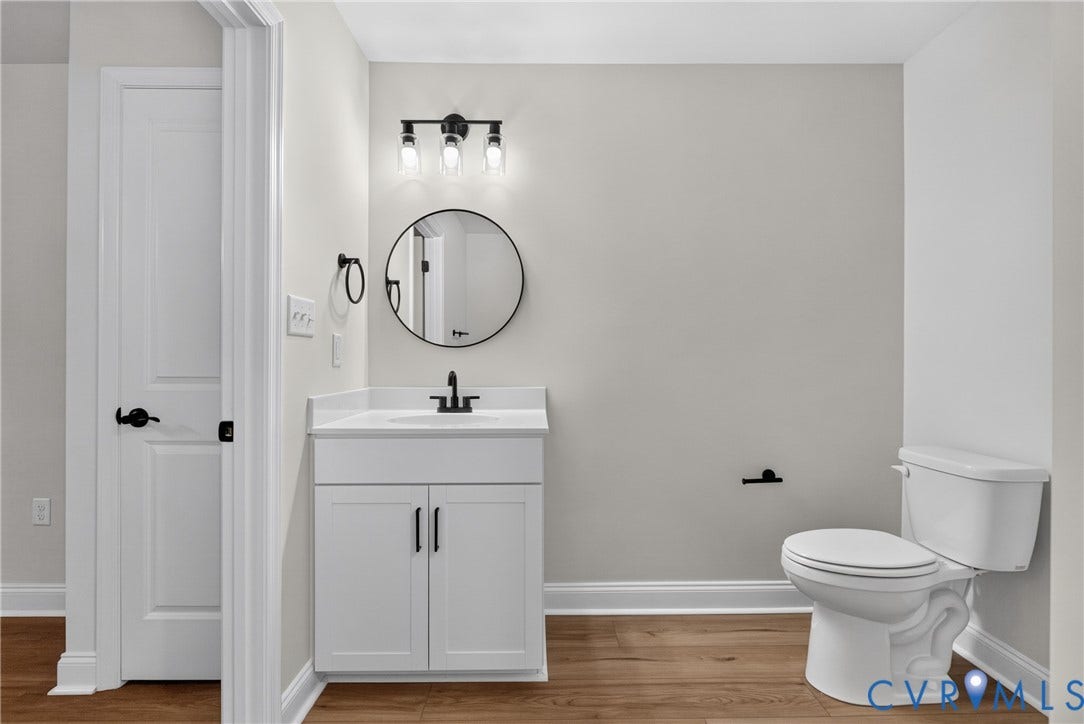 6549 Hardee Haven Place, Midlothian, VA 23112 White vanity with matte black hardware, single white basin, white countertop, and dark wood-finish flooring