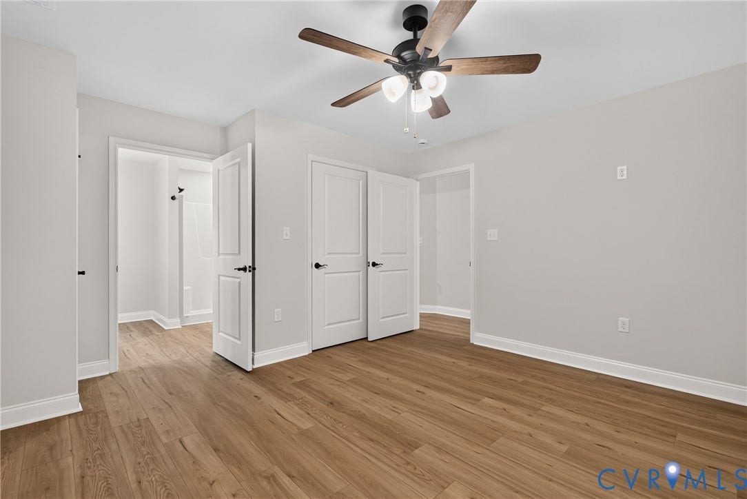 6549 Hardee Haven Place, Midlothian, VA 23112 Wood-finish flooring, recessed lighting, ceiling fan with wood-tone blades, white paneled doors, and light gray wall finish