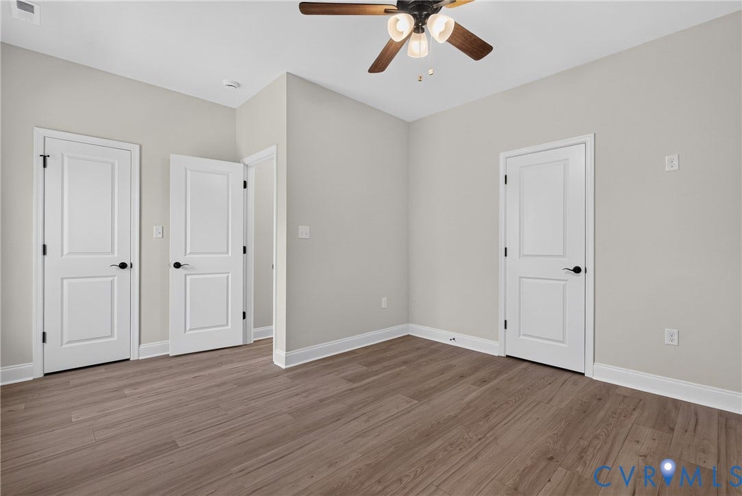 6549 Hardee Haven Place, Midlothian, VA 23112 Wood-finish flooring, ceiling fan with integrated lighting, painted interior doors, and neutral wall tones