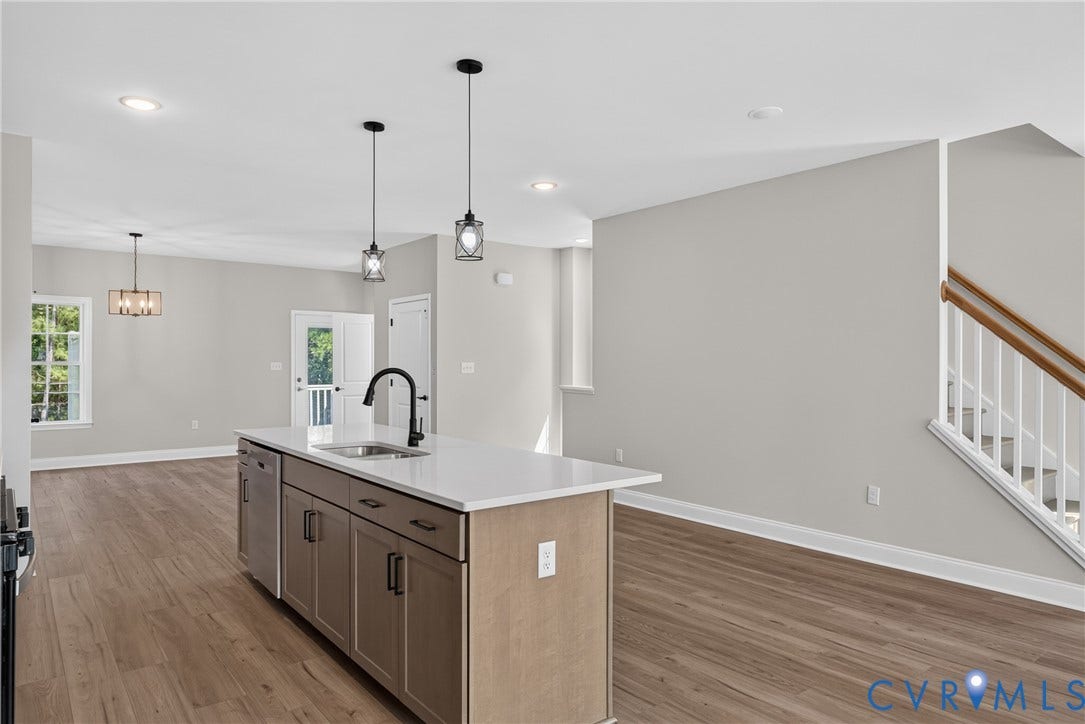 6549 Hardee Haven Place, Midlothian, VA 23112 Central kitchen island featuring a sink with a matte black faucet and integrated dishwasher