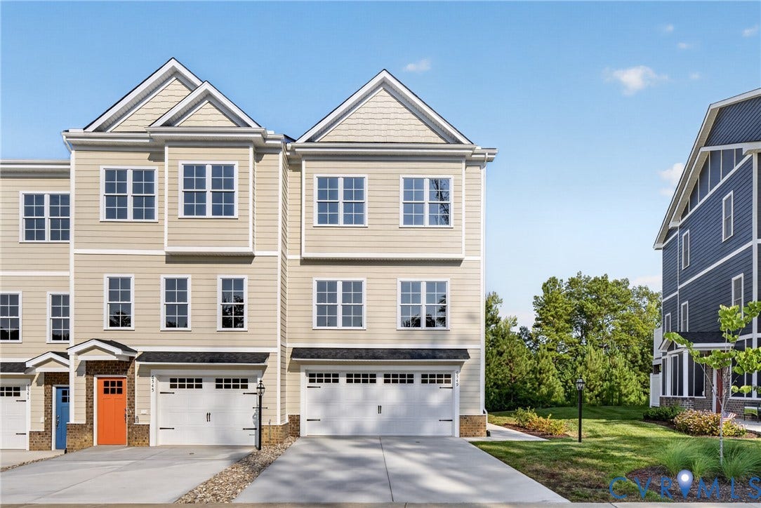 6549 Hardee Haven Place, Midlothian, VA 23112 Multi-story townhome featuring light-colored siding, multiple windows, a two-car garage, and a concrete driveway