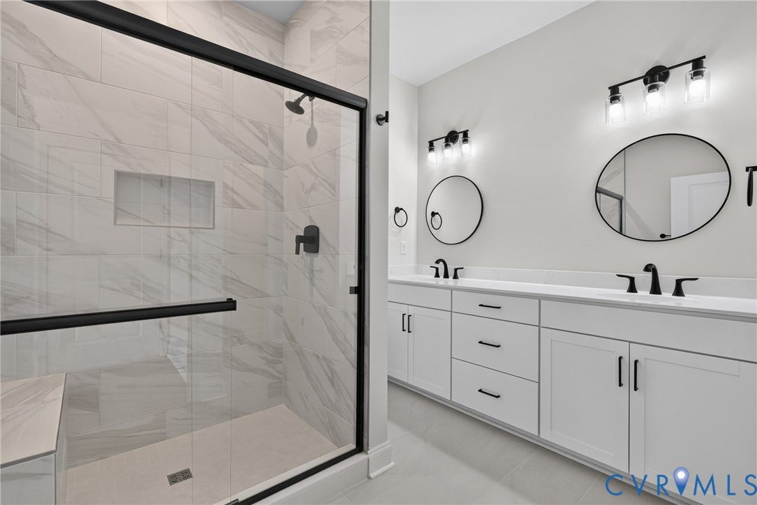 6549 Hardee Haven Place, Midlothian, VA 23112 Walk-in shower with a built-in bench, tiled walls, and black-framed glass enclosure