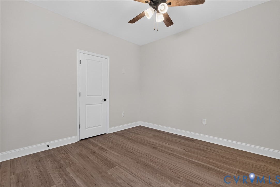 6549 Hardee Haven Place, Midlothian, VA 23112 Wood-finish flooring, light gray wall paint, and a ceiling fan with integrated lighting