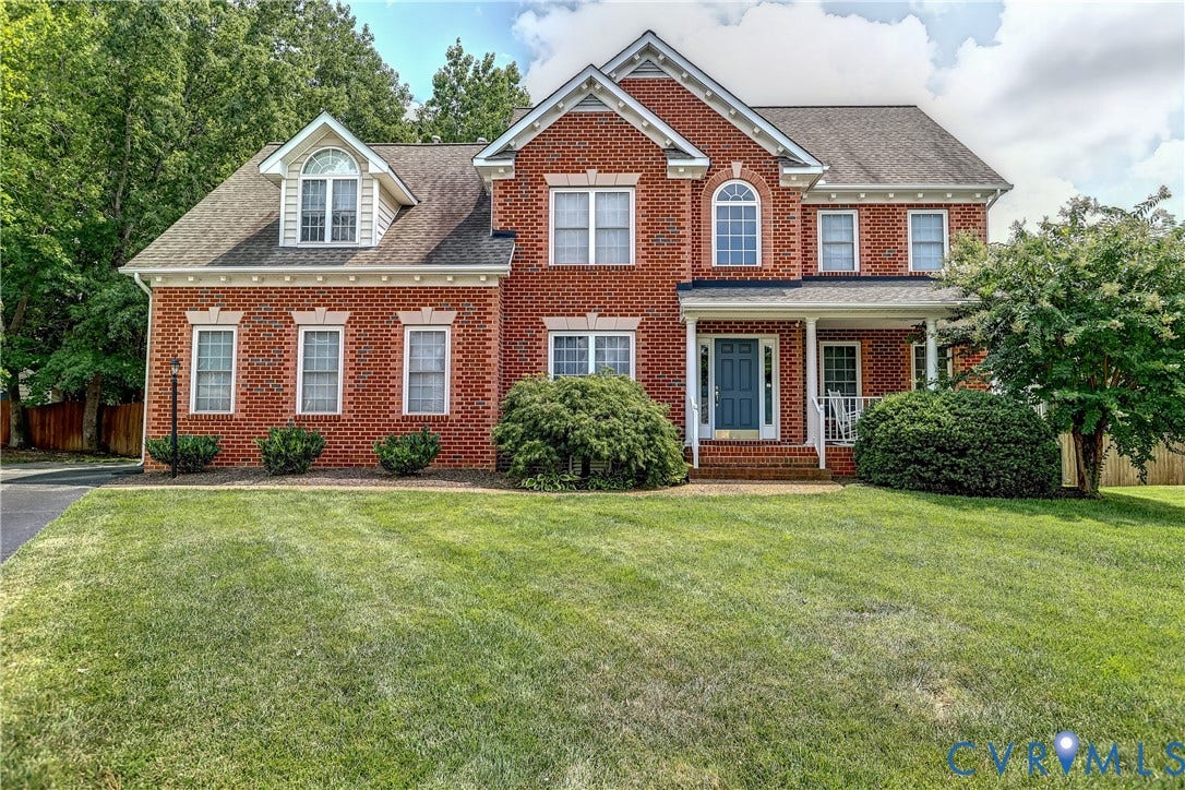 Traditional brick exterior with vaulted ceilings and finished third level media room.