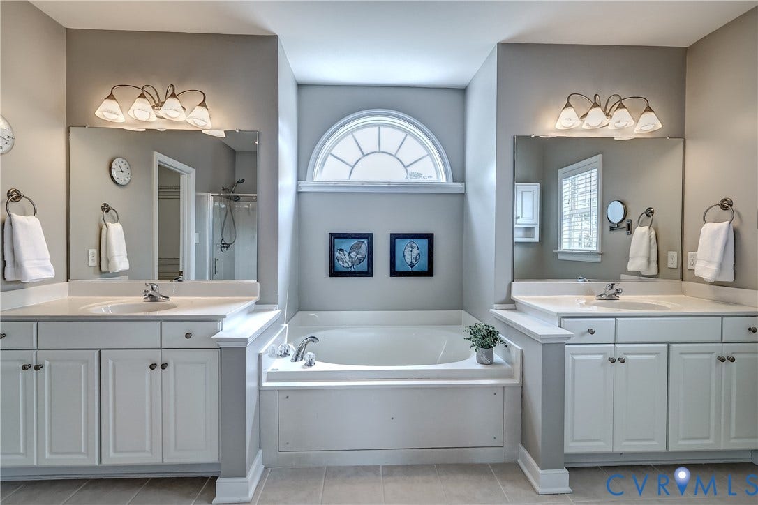 Primary bath with split vanities and soaking tub and seperate shower.