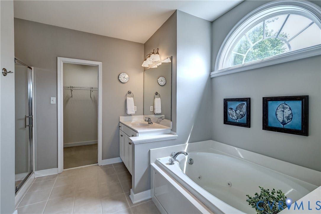 Primary bedroom bath with privacy window.