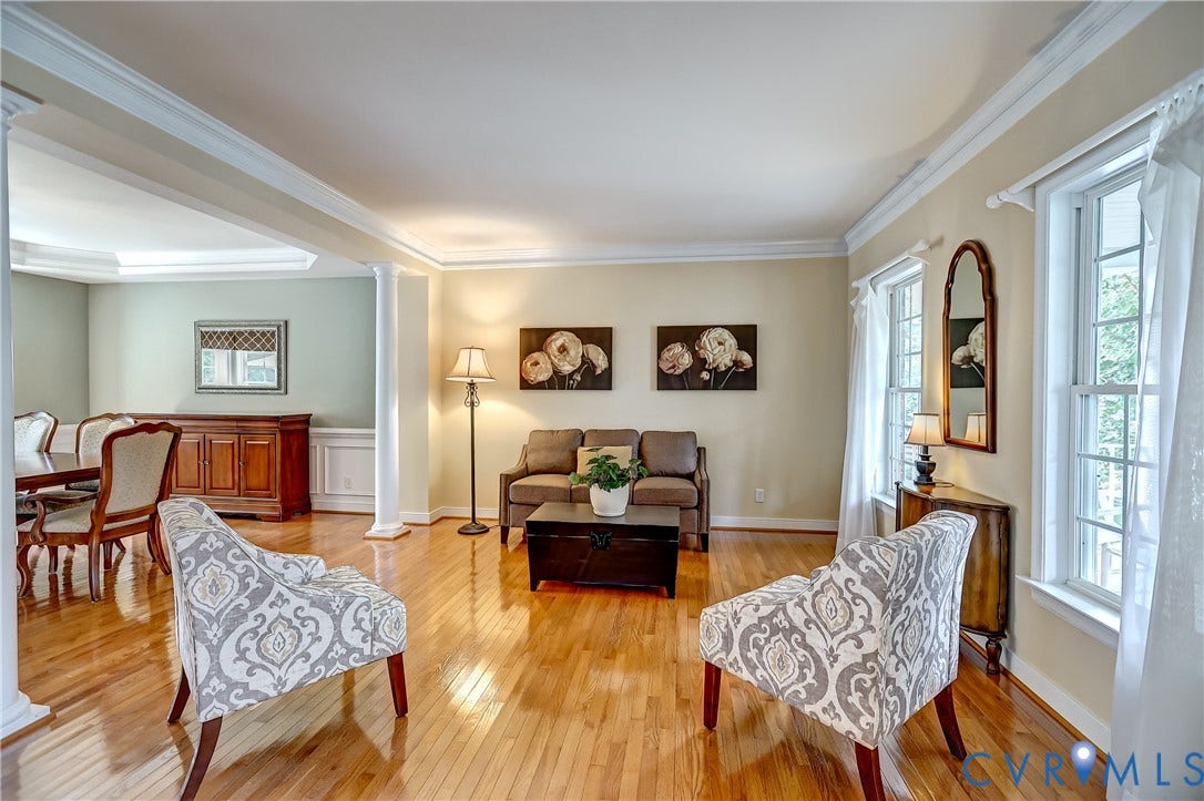 Just off the foyer with +9' ceilings, hardwood floors and accent columns.