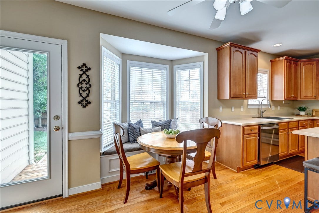 Bay window lets in lots of natural light and has a really fun window seat with storage below it.