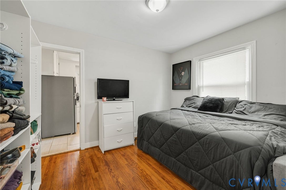 4819 Arundel Avenue, Chesterfield, VA 23234 Hardwood flooring, white walls, flush mount ceiling light, built-in shelving, white window blinds