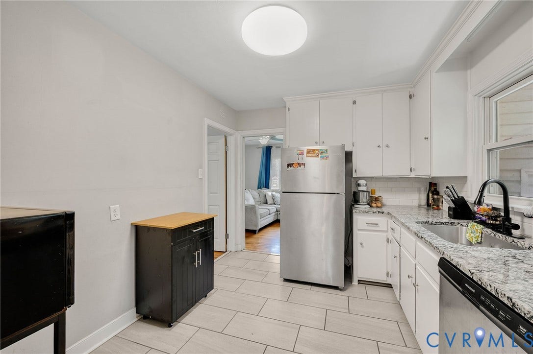 4819 Arundel Avenue, Chesterfield, VA 23234 Kitchen featuring tile flooring, white cabinetry, a stainless steel refrigerator, and a stainless steel sink with a black faucet