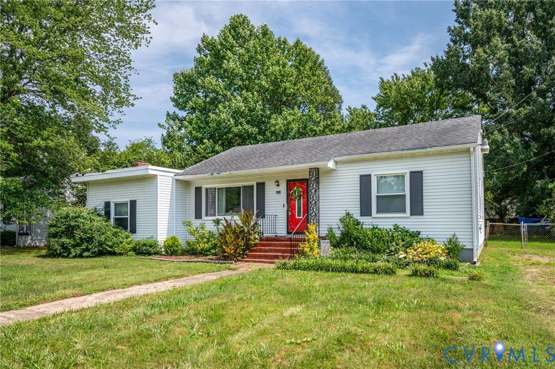 4819 Arundel Avenue, Chesterfield, VA 23234 White siding exterior with a red entry door, framed by dark shutters