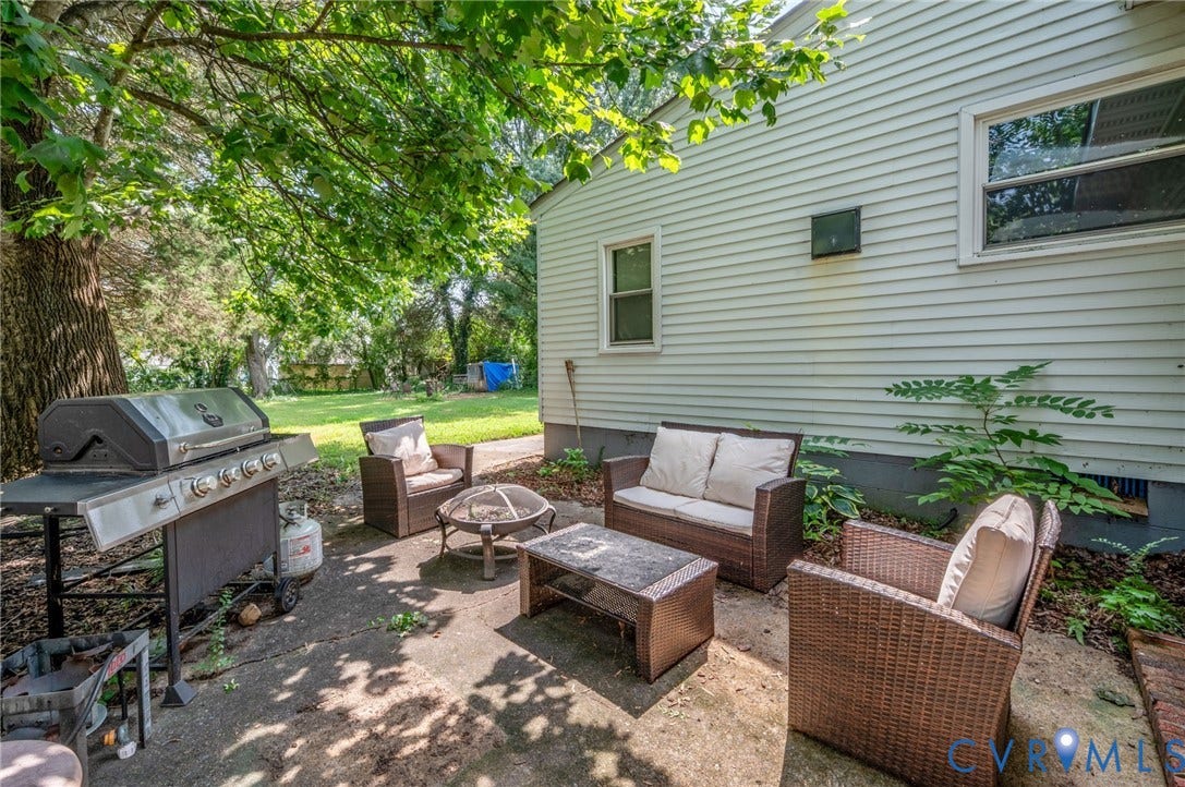 4819 Arundel Avenue, Chesterfield, VA 23234 Private outdoor patio with concrete paving and surrounding mature foliage