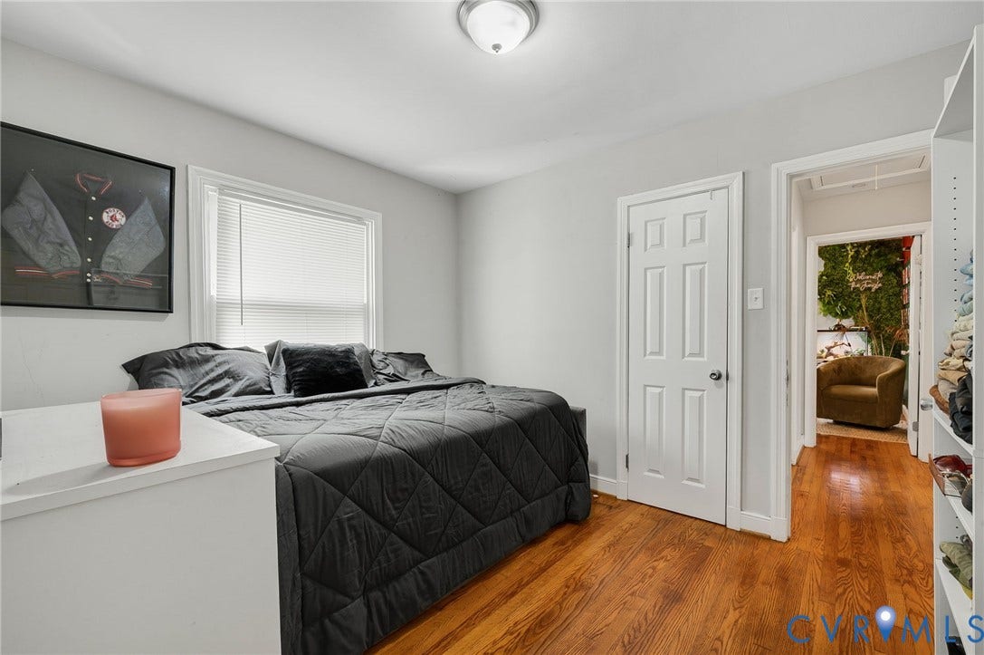4819 Arundel Avenue, Chesterfield, VA 23234 Wood-finish flooring, white trim work, and a ceiling-mounted light fixture