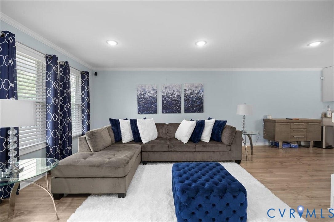Recessed ceiling lighting, crown molding, light wood-finish flooring, and window blinds
