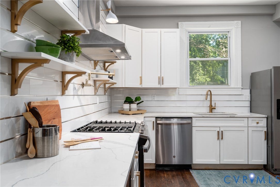 1906 W Main Street, Fan District, Richmond, VA 23220 Renovated first-floor kitchen with quartz countertops and stainless steel appliances.