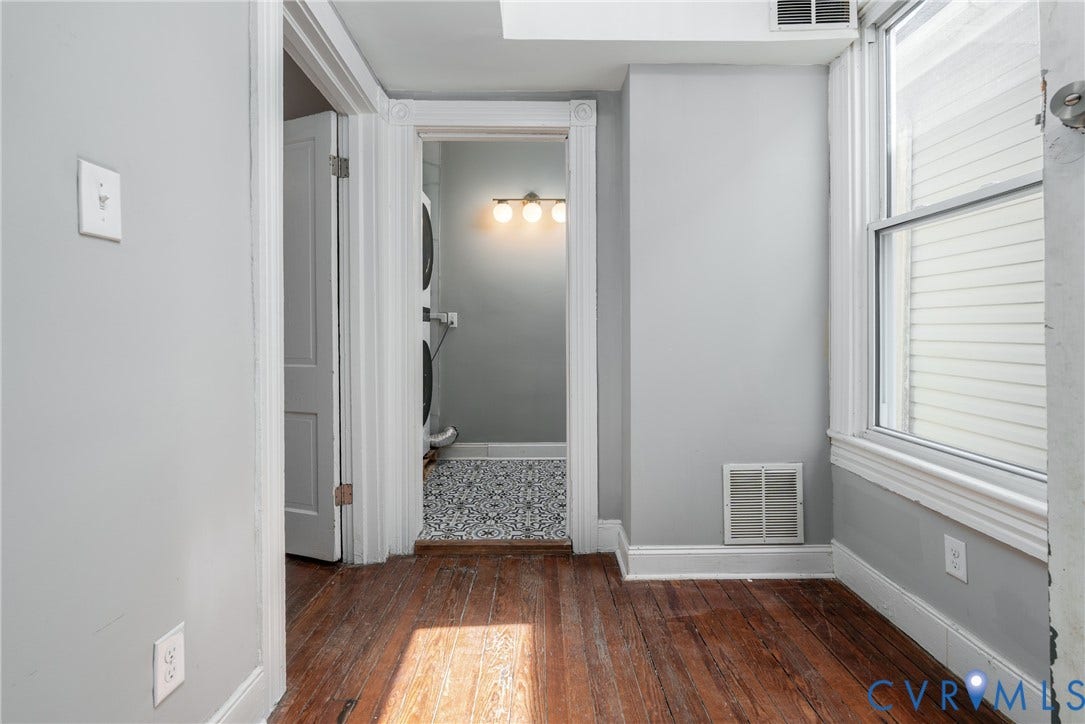 1906 W Main Street, Fan District, Richmond, VA 23220 Hallway space to second floor bedroom and large laundry room, stairs up to third level.