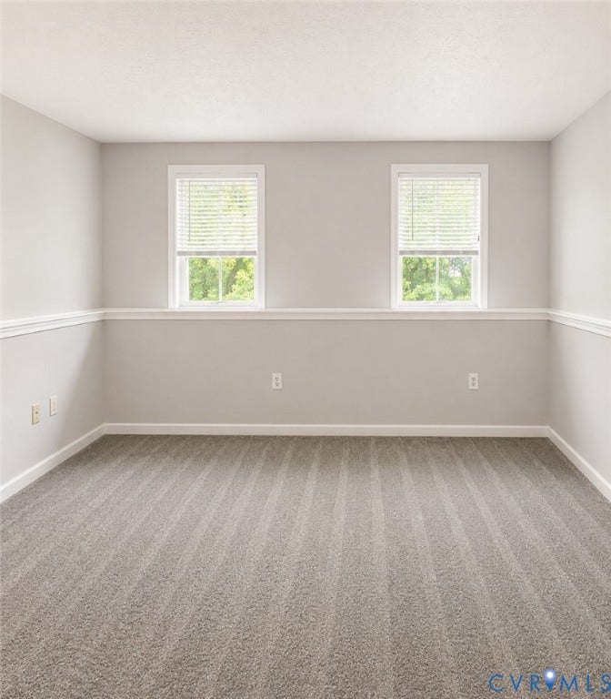 Primary Bedroom with two windows, walk-in closet and ensuite full bathroom