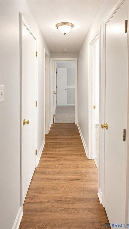 Central Hall to laundry room, hall bath, and bedrooms.