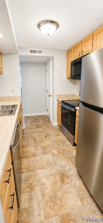 Galley-style kitchen, High-end vinyl flooring, Stainless appliances all new within 1-2 years