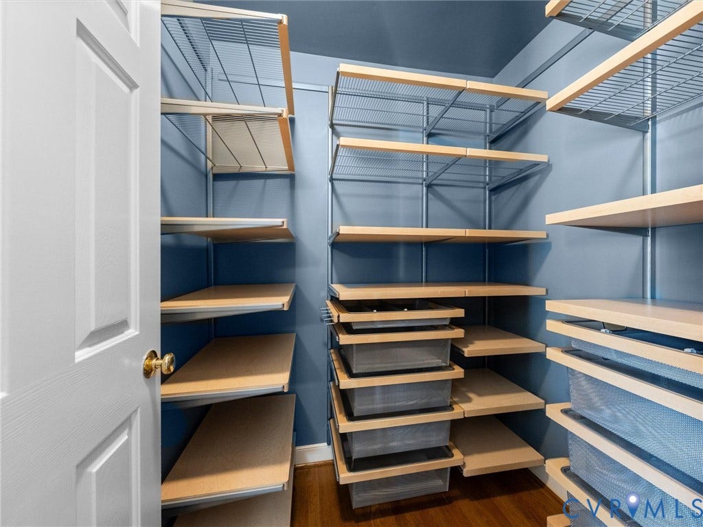 15706 Fox Marsh Drive, Moseley, VA 23120 Built-in custom shelving system featuring wood-finish shelves and wire mesh drawers
