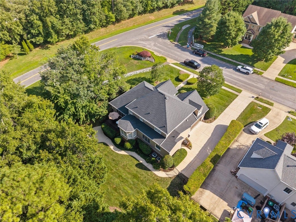 15706 Fox Marsh Drive, Moseley, VA 23120 Expansive property featuring a multi-level roofline, well-maintained landscaping, and mature trees providing natural screening
