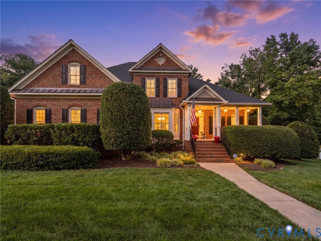 15706 Fox Marsh Drive, Moseley, VA 23120 Brick exterior featuring gabled rooflines, black shutters, and a covered porch with white columns