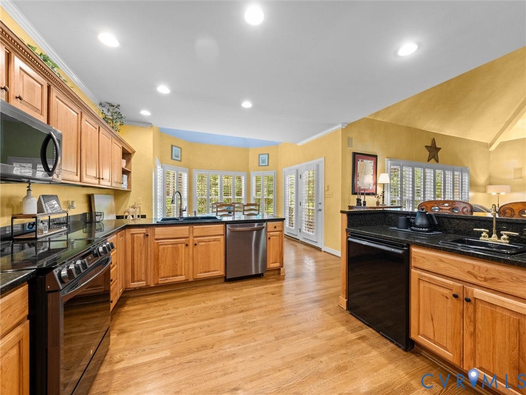 15706 Fox Marsh Drive, Moseley, VA 23120 Kitchen featuring wood cabinetry, dark countertops, wood-finish flooring, stainless steel appliances, and double doors