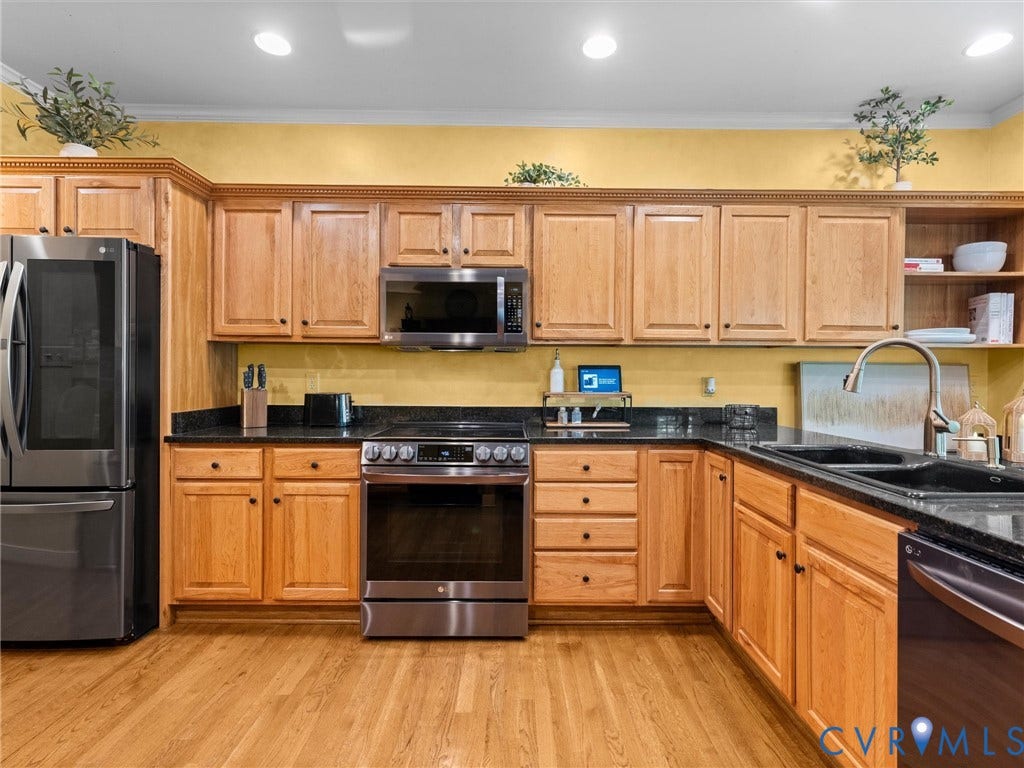 15706 Fox Marsh Drive, Moseley, VA 23120 Kitchen featuring wood-finish flooring, natural wood cabinetry, dark countertops, a stainless steel range, and a stainless steel refrigerator