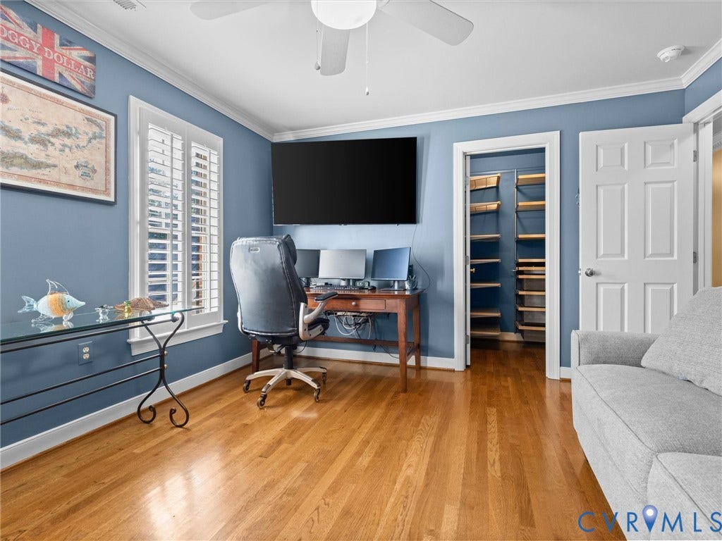 15706 Fox Marsh Drive, Moseley, VA 23120 Hardwood flooring, crown molding, white plantation shutters, ceiling fan, and built-in closet shelving