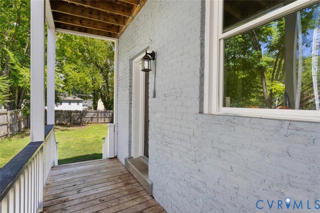313 W 27th Street, Richmond, VA 23225 Covered wood-finish porch with a white railing